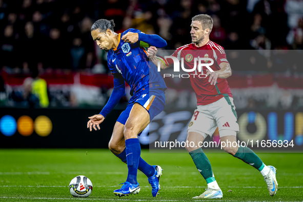 Netherlands defender Virgil van Dijk and Hungary forward Barnabas Varga play during the match between Hungary and the Netherlands at the Pus...