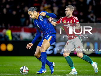 Netherlands defender Virgil van Dijk and Hungary forward Barnabas Varga play during the match between Hungary and the Netherlands at the Pus...