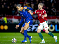 Netherlands defender Virgil van Dijk and Hungary forward Barnabas Varga play during the match between Hungary and the Netherlands at the Pus...