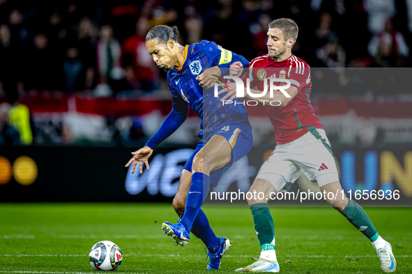 Netherlands defender Virgil van Dijk and Hungary forward Barnabas Varga play during the match between Hungary and the Netherlands at the Pus...