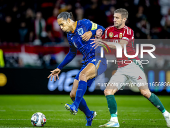 Netherlands defender Virgil van Dijk and Hungary forward Barnabas Varga play during the match between Hungary and the Netherlands at the Pus...