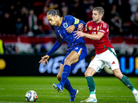 Netherlands defender Virgil van Dijk and Hungary forward Barnabas Varga play during the match between Hungary and the Netherlands at the Pus...