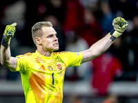 Hungary goalkeeper Denes Dibusz celebrates the goal of Hungary forward Roland Sallai during the match between Hungary and the Netherlands at...