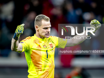 Hungary goalkeeper Denes Dibusz celebrates the goal of Hungary forward Roland Sallai during the match between Hungary and the Netherlands at...