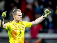 Hungary goalkeeper Denes Dibusz celebrates the goal of Hungary forward Roland Sallai during the match between Hungary and the Netherlands at...