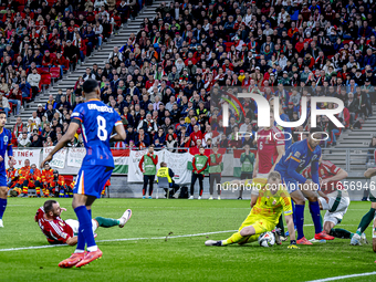 Scimmige scores a goal against Hungary goalkeeper Denes Dibusz during the match between Hungary and the Netherlands at the Puskas Arena for...