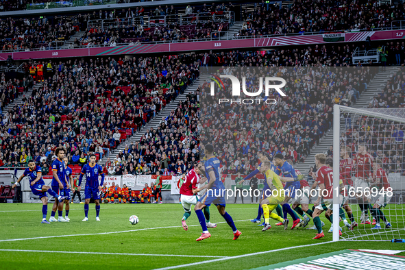 Scimmige scores a goal against Hungary goalkeeper Denes Dibusz during the match between Hungary and the Netherlands at the Puskas Arena for...