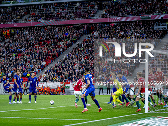 Scimmige scores a goal against Hungary goalkeeper Denes Dibusz during the match between Hungary and the Netherlands at the Puskas Arena for...