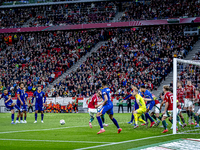 Scimmige scores a goal against Hungary goalkeeper Denes Dibusz during the match between Hungary and the Netherlands at the Puskas Arena for...