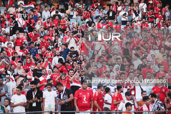 The fans cheer for the team during the match between Egypt and Mauritania in the African Cup of Nations qualifiers in Cairo, Egypt, on Octob...