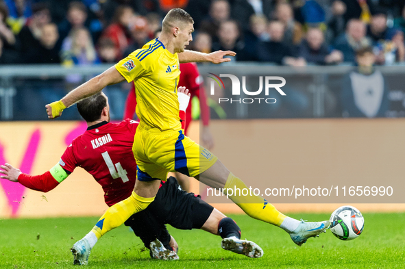 Guram Kashia, Artem Dovbyk are playing during the  UEFA Nations League 2024 League B Group B1 match between Ukraine and Georgia , at the Poz...