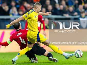 Guram Kashia, Artem Dovbyk are playing during the  UEFA Nations League 2024 League B Group B1 match between Ukraine and Georgia , at the Poz...