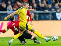 Guram Kashia, Artem Dovbyk are playing during the  UEFA Nations League 2024 League B Group B1 match between Ukraine and Georgia , at the Poz...