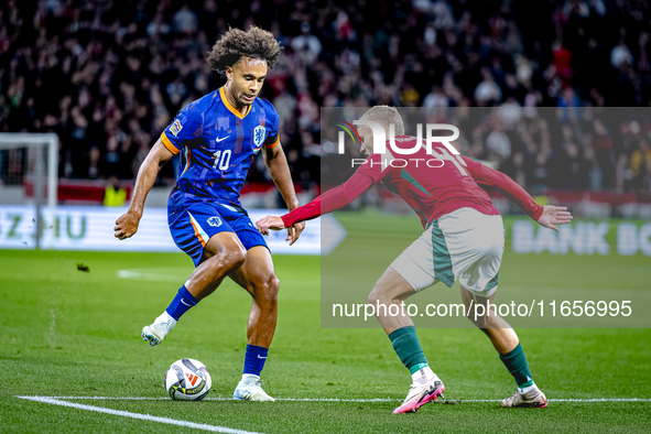 Netherlands forward Joshua Zirkzee and Hungary defender Marton Dardai play during the match between Hungary and the Netherlands at the Puska...