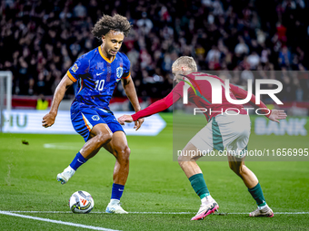 Netherlands forward Joshua Zirkzee and Hungary defender Marton Dardai play during the match between Hungary and the Netherlands at the Puska...