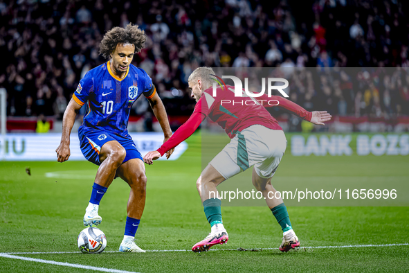 Netherlands forward Joshua Zirkzee and Hungary defender Marton Dardai play during the match between Hungary and the Netherlands at the Puska...