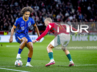 Netherlands forward Joshua Zirkzee and Hungary defender Marton Dardai play during the match between Hungary and the Netherlands at the Puska...