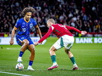 Netherlands forward Joshua Zirkzee and Hungary defender Marton Dardai play during the match between Hungary and the Netherlands at the Puska...