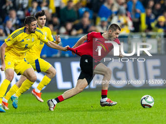 Ivan Kaliuzhnyi, Giorgi Chakvetadze are playing during the  UEFA Nations League 2024 League B Group B1 match between Ukraine and Georgia , a...