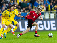 Ivan Kaliuzhnyi, Giorgi Chakvetadze are playing during the  UEFA Nations League 2024 League B Group B1 match between Ukraine and Georgia , a...