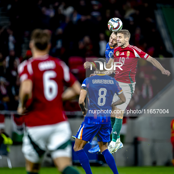 Netherlands defender Stefan de Vrij and Hungary forward Barnabas Varga are present during the match between Hungary and the Netherlands at t...