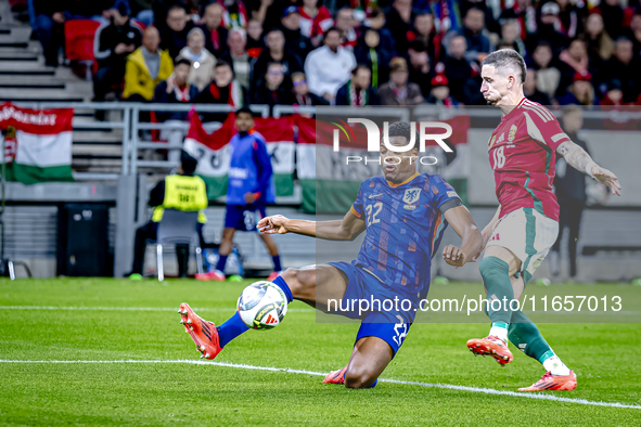 Netherlands defender Denzel Dumfries and Hungary midfielder Zsolt Nagy play during the match between Hungary and the Netherlands at the Pusk...