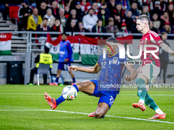 Netherlands defender Denzel Dumfries and Hungary midfielder Zsolt Nagy play during the match between Hungary and the Netherlands at the Pusk...