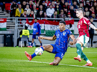 Netherlands defender Denzel Dumfries and Hungary midfielder Zsolt Nagy play during the match between Hungary and the Netherlands at the Pusk...