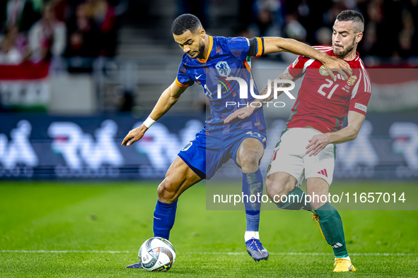 Netherlands forward Cody Gakpo and Hungary defender Endre Botka play during the match between Hungary and the Netherlands at the Puskas Aren...