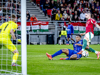 Netherlands defender Denzel Dumfries and Hungary midfielder Zsolt Nagy play during the match between Hungary and the Netherlands at the Pusk...