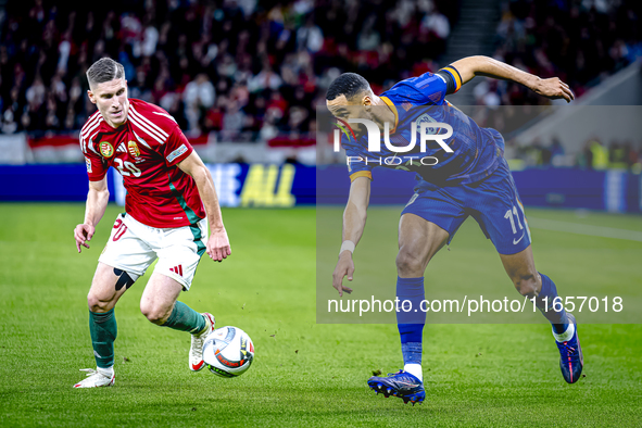 Hungary forward Roland Sallai and Netherlands forward Cody Gakpo participate in the match between Hungary and the Netherlands at the Puskas...