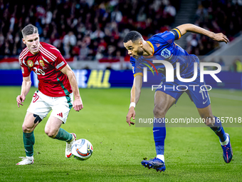 Hungary forward Roland Sallai and Netherlands forward Cody Gakpo participate in the match between Hungary and the Netherlands at the Puskas...