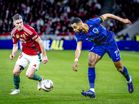 Hungary forward Roland Sallai and Netherlands forward Cody Gakpo participate in the match between Hungary and the Netherlands at the Puskas...