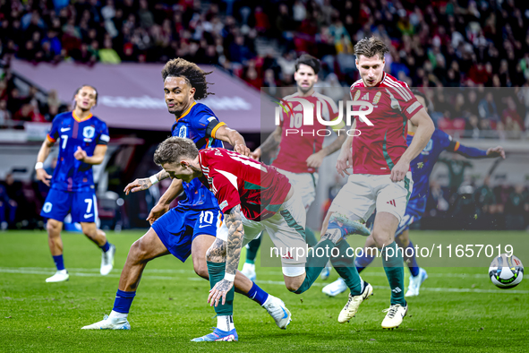 Netherlands forward Joshua Zirkzee and Hungary forward Barnabas Varga play during the match between Hungary and the Netherlands at the Puska...