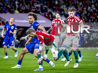 Netherlands forward Joshua Zirkzee and Hungary forward Barnabas Varga play during the match between Hungary and the Netherlands at the Puska...