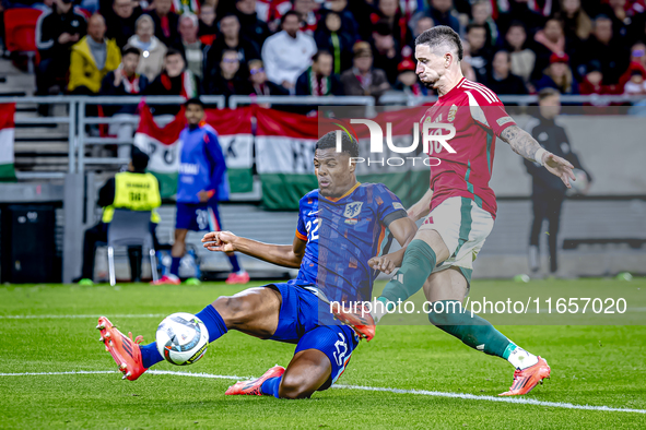 Netherlands defender Denzel Dumfries and Hungary midfielder Zsolt Nagy play during the match between Hungary and the Netherlands at the Pusk...