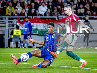 Netherlands defender Denzel Dumfries and Hungary midfielder Zsolt Nagy play during the match between Hungary and the Netherlands at the Pusk...