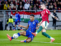 Netherlands defender Denzel Dumfries and Hungary midfielder Zsolt Nagy play during the match between Hungary and the Netherlands at the Pusk...