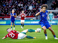 Hungary defender Endre Botka and Netherlands forward Joshua Zirkzee participate in the match between Hungary and the Netherlands at the Pusk...