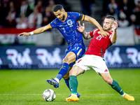 Netherlands forward Cody Gakpo and Hungary defender Endre Botka play during the match between Hungary and the Netherlands at the Puskas Aren...