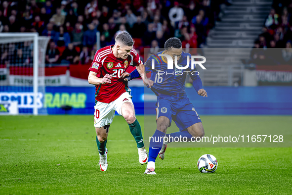 Hungary midfielder Dominik Szoboszlai and Netherlands midfielder Quinten Timber play during the match between Hungary and the Netherlands at...