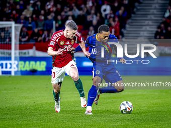 Hungary midfielder Dominik Szoboszlai and Netherlands midfielder Quinten Timber play during the match between Hungary and the Netherlands at...