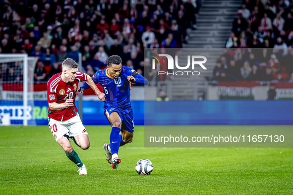 Hungary midfielder Dominik Szoboszlai and Netherlands midfielder Quinten Timber play during the match between Hungary and the Netherlands at...