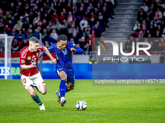 Hungary midfielder Dominik Szoboszlai and Netherlands midfielder Quinten Timber play during the match between Hungary and the Netherlands at...