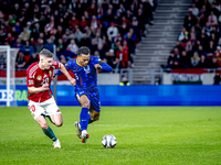 Hungary midfielder Dominik Szoboszlai and Netherlands midfielder Quinten Timber play during the match between Hungary and the Netherlands at...