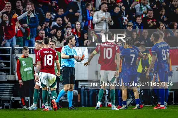 Netherlands defender Virgil van Dijk receives a red card during the match between Hungary and the Netherlands at the Puskas Arena for the UE...