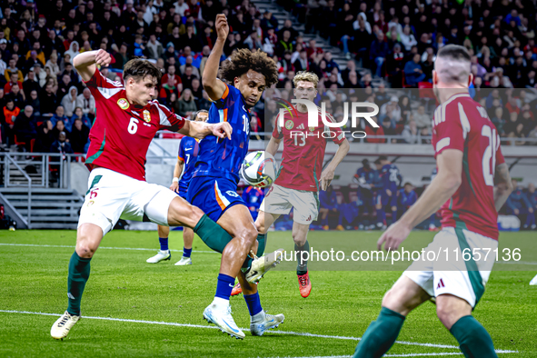 Hungary defender Willi Orban and Netherlands forward Joshua Zirkzee are present during the match between Hungary and the Netherlands at the...