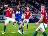 Hungary defender Willi Orban and Netherlands forward Joshua Zirkzee are present during the match between Hungary and the Netherlands at the...