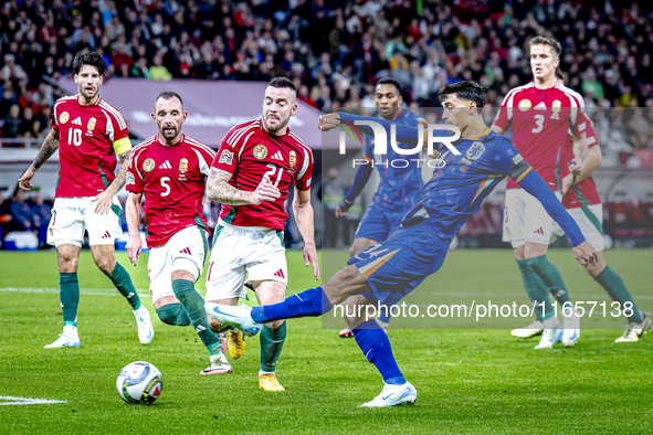 Hungary defender Endre Botka and Netherlands midfielder Tijani Reijnders play during the match between Hungary and the Netherlands at the Pu...