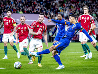 Hungary defender Endre Botka and Netherlands midfielder Tijani Reijnders play during the match between Hungary and the Netherlands at the Pu...